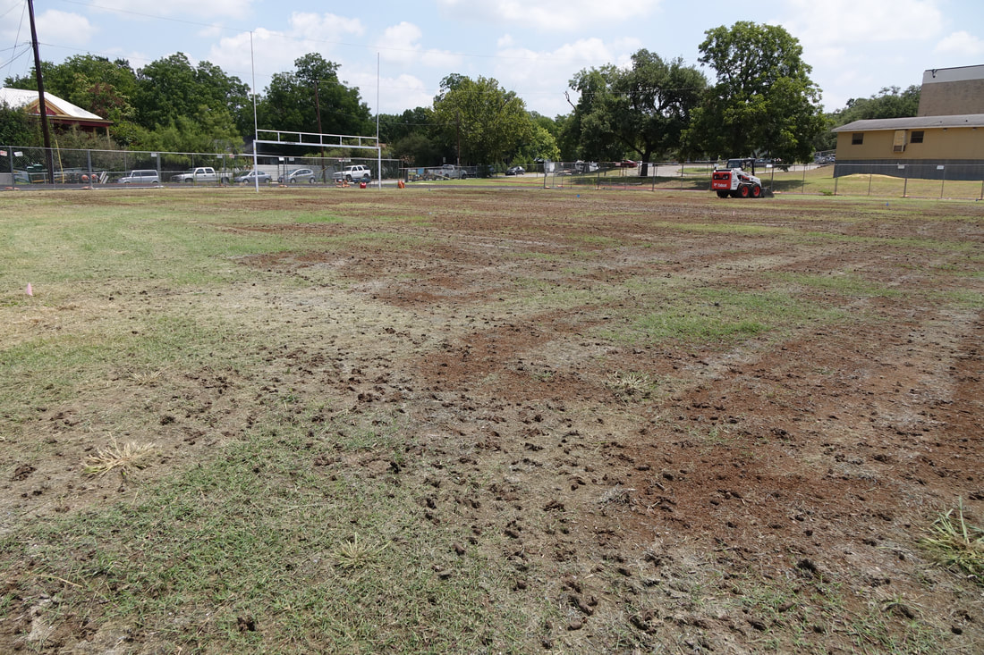 Aeration service on a football field in Austin