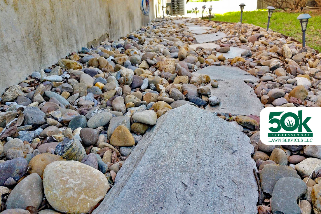 Flagstone Steps Pathway with River Rocks and Metal Edging Installation at the Montopolis neighborhood in east Austin.