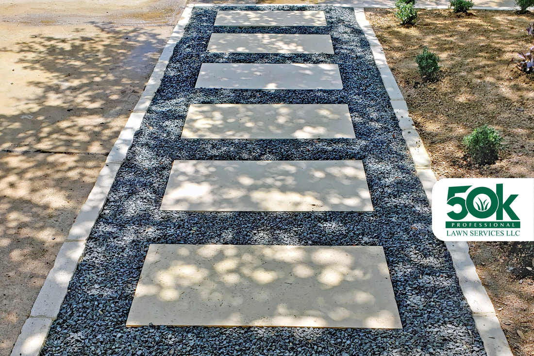 Gravel and Limestone Slab with Limestone Edging and Decomposed Granite installation at the Crossing at Onion Creek neighborhood in south Austin.